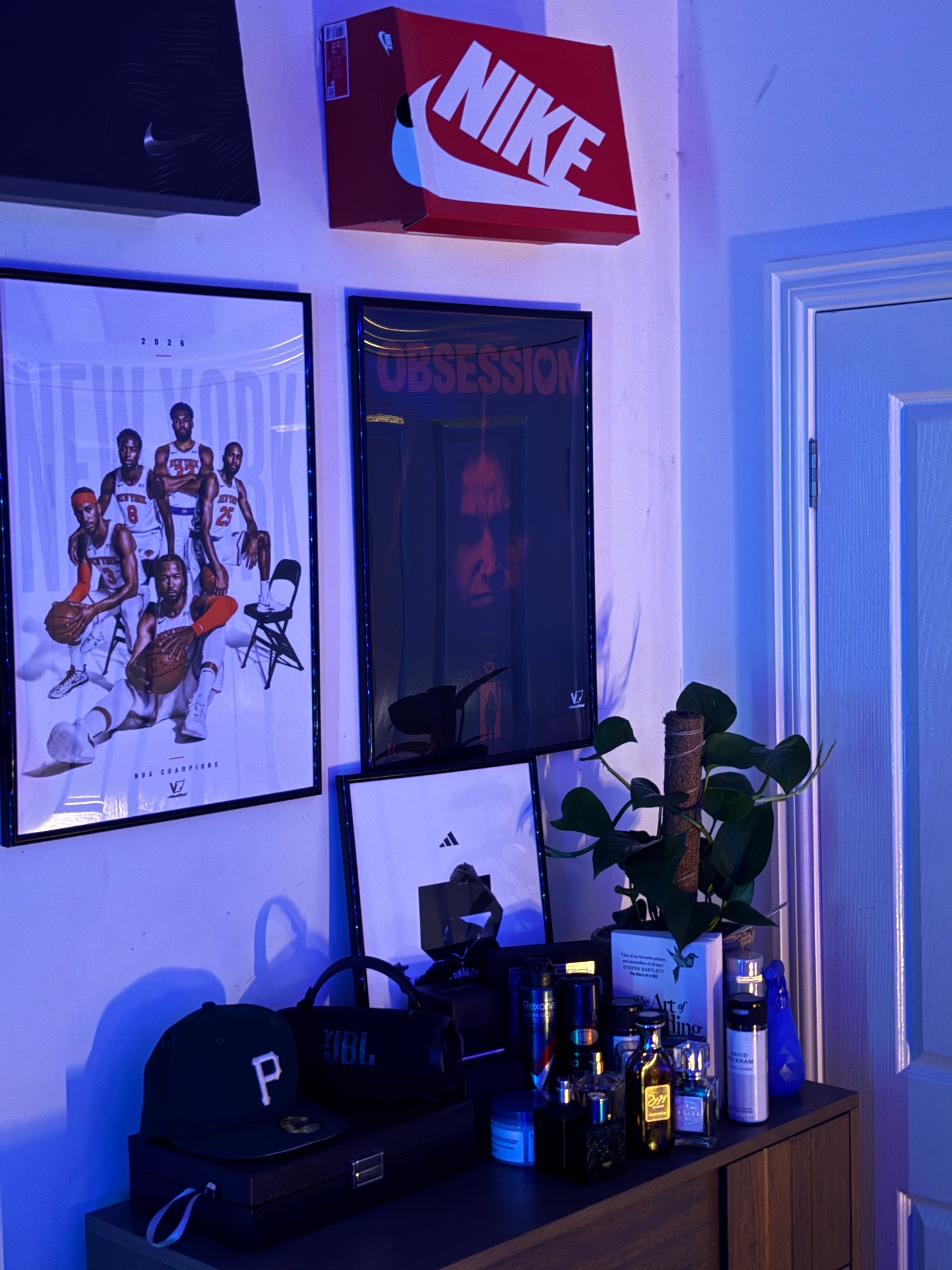 Framed VISUALISE New York and Obsession posters with LED lighting